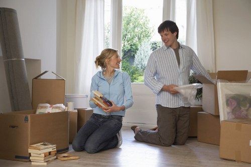 Boxes and office furniture prepared for relocation in a central London workspace