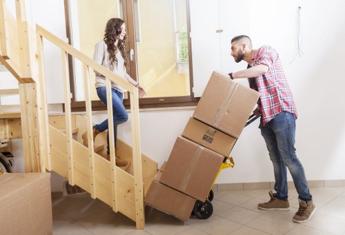Employee using PPE while handling storage items