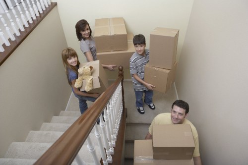 Local removal team preparing delicate items for transport